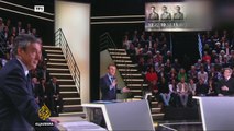 French presidential hopefuls clash on immigration in live debate