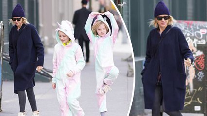 En pointe! Naomi Watts' sons rug up in adorable unicorn onesies in chilly New York weather as nine-year-old Samuel performs ballet pirouette on sidewalk.