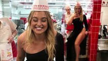 Underwear free Iskra Lawrence has a very cheeky response after being told off for sitting on the counter in fast food eatery in THAT sexy thigh-split dress.