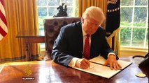 Trump signs new immigration order excluding Iraq