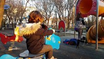 Happy baby Mizn discovering a new playground and enjoying