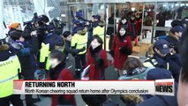 North Korean athletes and cheering squad return home