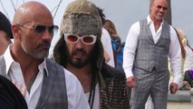 Man of style! Dwayne 'The Rock' Johnson dons sharp grey suit as he films Ballers alongside Russell Brand.