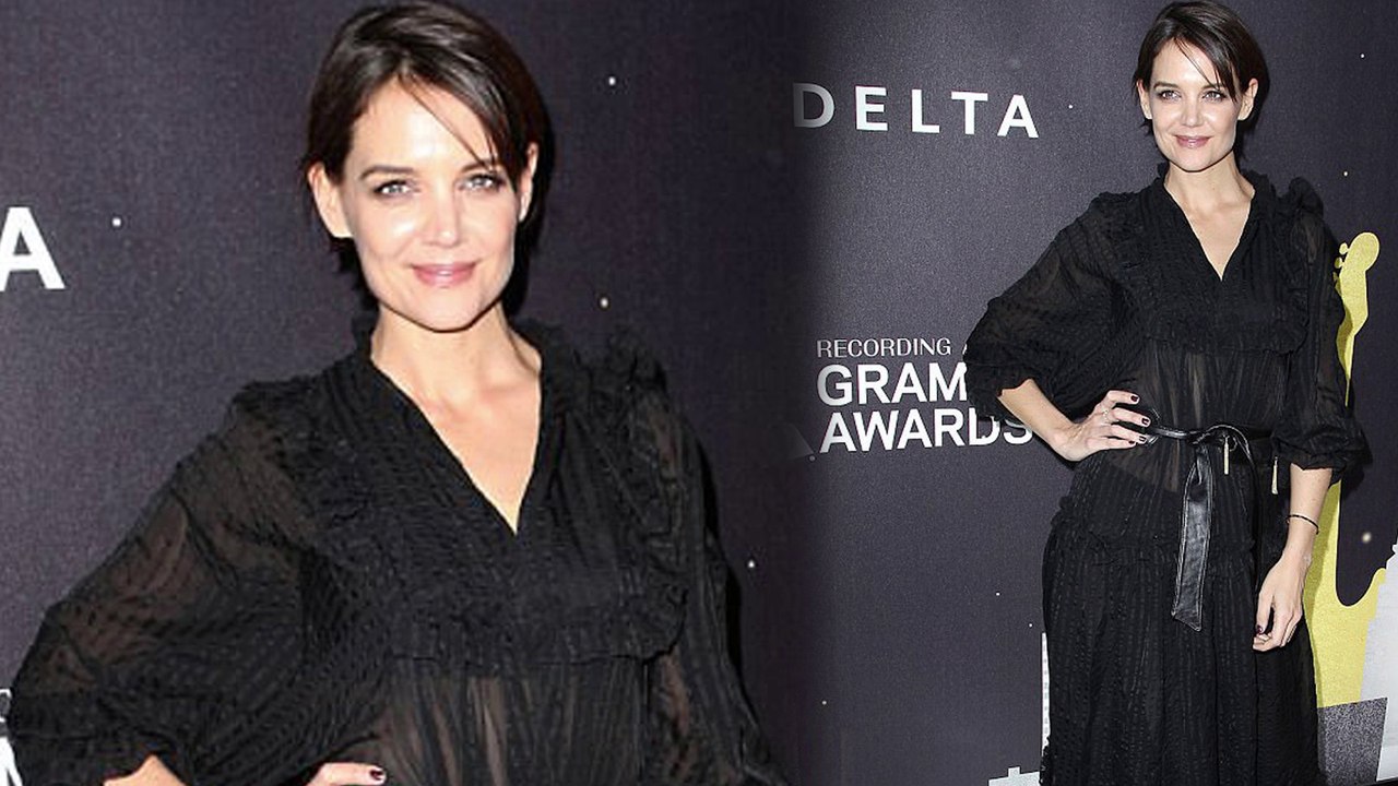 Katie Holmes looks chic in sheer black dress while attending Delta Airlines' Grammy event in New York City.