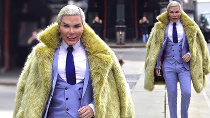 'Human Ken Doll' Rodrigo Alves proudly flaunts his enhanced physique in dramatic fur coat and three-piece blue suit in New York City... after posing for sexy gender fluidity shoot.
