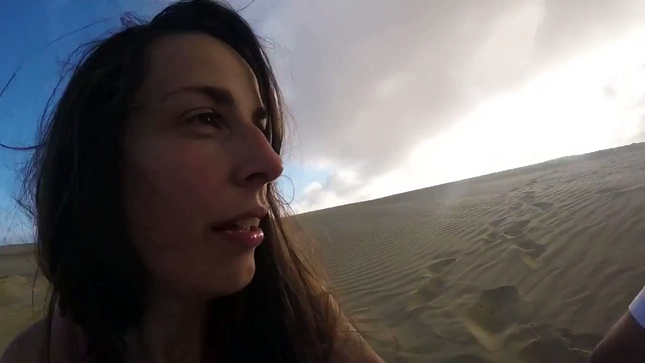 Sand Flies in Woman's Face While Sandboarding