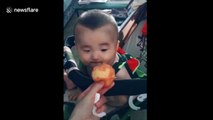 Baby has cutest reaction looking at a peach