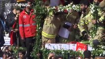 Tens of thousands in Tehran for firefighters' funeral
