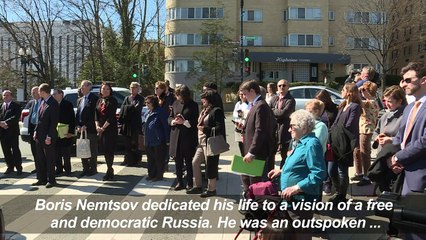 In message to Putin, Washington names plaza after slain critic