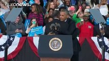 'Reject the dark side' urges Obama at a Clinton campaign rally