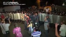 Dozens wounded in further night of clashes at besieged Yerevan police station