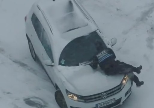 French Policeman Loses His Grip During Storm Emma