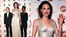 Proud Shiloh, 11, and Zahara, 13, join mom Angelina Jolie on red carpet to support her at awards show.