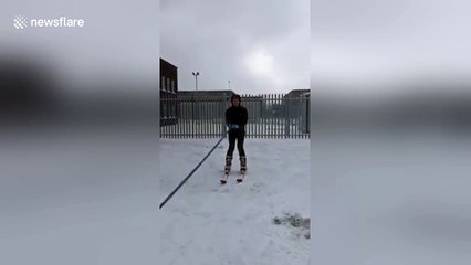 Man skis through snow-filled street after massive storm in Dublin