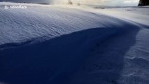 Wind blasts snow over golf course during massive UK storm