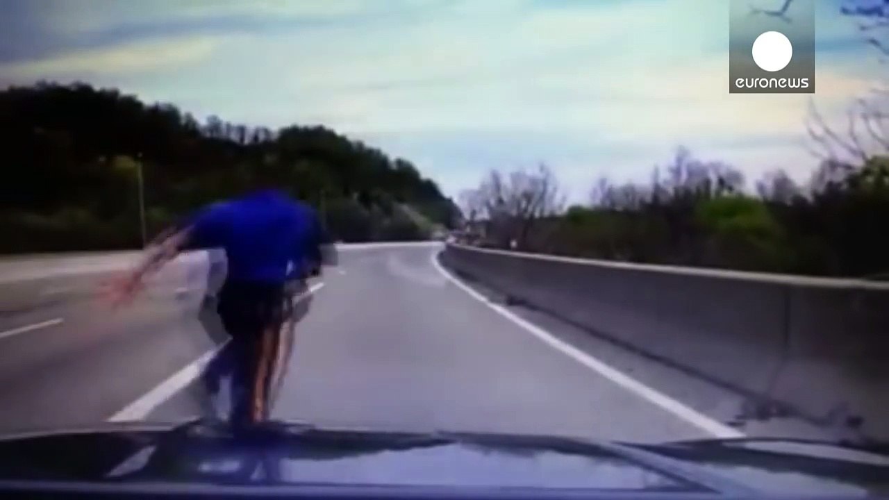 Police dashcam: Moment officer tackles man trying to jump off bridge, USA