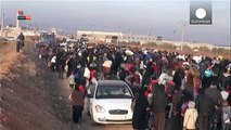 Syrians flee to Turkish border as government forces close in on Aleppo