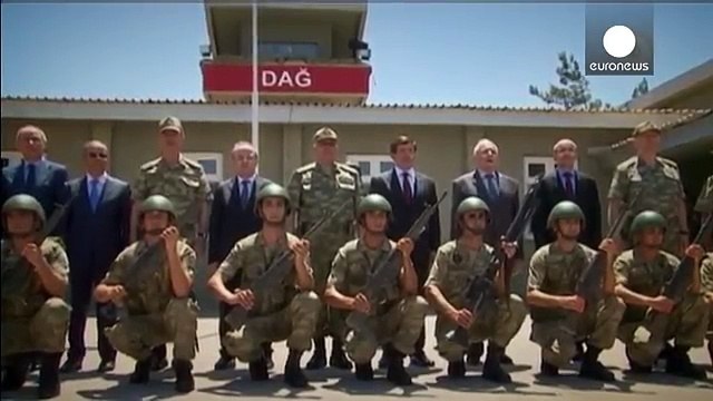 Turkish PM visits ISIL-hit border region as police clash with PKK supporters