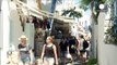Tourists enjoying Mykonos sun aware of Greek hosts' dark clouds