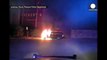 Dashcam footage: Police officer drags man from burning car, US