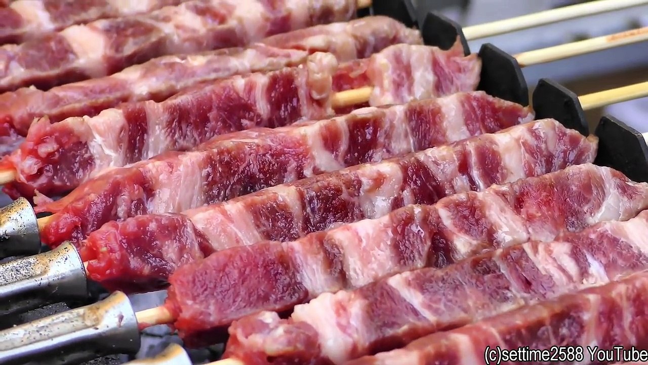 London Street Food from Italy. Arrosticini Small Sticks of Sheep Meat Roasted on Charcoal