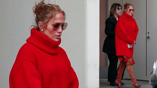 Jennifer Lopez wraps up in over-sized scarlet sweater dress and thigh-high boots for designer shopping spree.