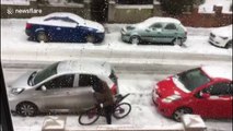 Funny moment man attempts to ride bike on icy UK road