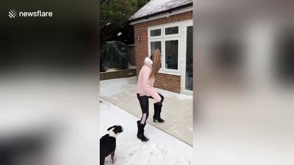 Woman slips on ice trying to open back door