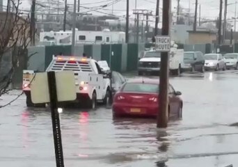 Tow Truck Pushes Vehicle Out of Long Island Floodwater