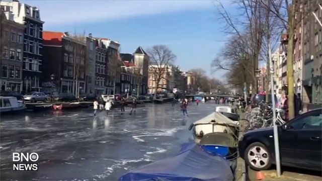 Ice skaters grace over frozen canals during Netherlands cold snap
