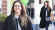Doting mom! Makeup free Jessica Alba bundles up in black coat as she holds hands with daughter Honor for retail outing in Beverly Hills.