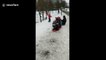 UK policeman challenges children to sledging race