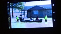 Arkansas Families Rescued by Boat from Flooding