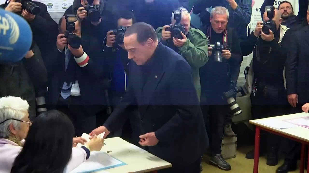 Topless woman disrupts Berlusconi's vote