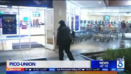 Download Video: Police Searching for Suspected Robber Who Slashed Woman`s Neck in L.A. Laundromat