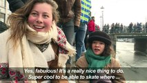 Ice skaters enjoy frozen Amsterdam canals