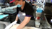 Hong Kong Street Food. Cooking Fried Loaves of Bread. Action in the Kitchen of a Chiense Restaurant