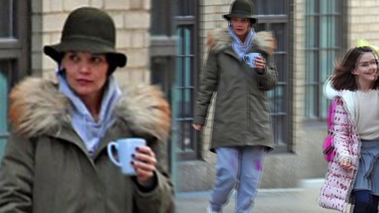 She took her coffee to go! Makeup-free Katie Holmes holds onto blue mug as she takes daughter Suri Cruise, 11, to school in New York City.