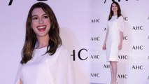 Miranda Priestly would be proud! Anne Hathaway is elegant in white dress as she attends photo call for cosmetics line in South Korea.