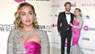 Miley Cyrus oozes old Hollywood glamour in glittery cut-out gown as she joins Liam Hemsworth at Elton John's Oscars bash