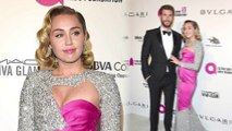 Miley Cyrus oozes old Hollywood glamour in glittery cut-out gown as she joins Liam Hemsworth at Elton John's Oscars bash
