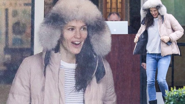 No umbrella needed! Jennifer Garner shields herself from the rain in furry hooded coat as she runs errands
