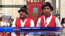 Artists dance for the Pope while he returns their gifted drum