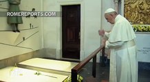 Pope Francis prays before the tombs of the 