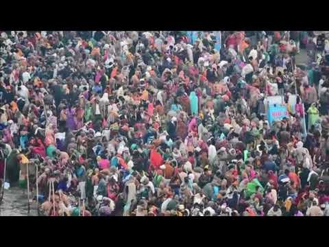 Hindu pilgrims take a holy bath in the Ganges