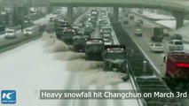 Snow plows clearing a busy road in Changchun, can't miss it!