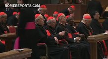 Cardinals pray in St. Peter's Basilica as they prepare for the Conclave