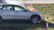 Police Officers Pull Woman from Car Before It Bursts Into Flames