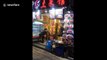 Chinese waiter's over-enthusiastic dance to reel in customers