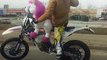 Man Rides Motorcycle with Stuffed Unicorn